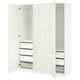 A white PAX wardrobe with open doors, featuring drawers and shelves. Its a sleek, modern design made of particleboard and fiberboard.