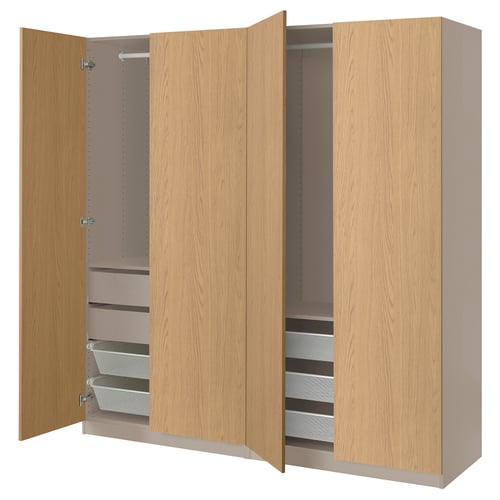 Light brown ikea PAX wardrobe with open doors revealing mesh baskets inside.