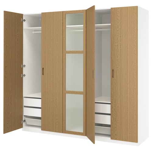 This image a wooden PAX wardrobe with open doors, displaying shelves and drawers inside.