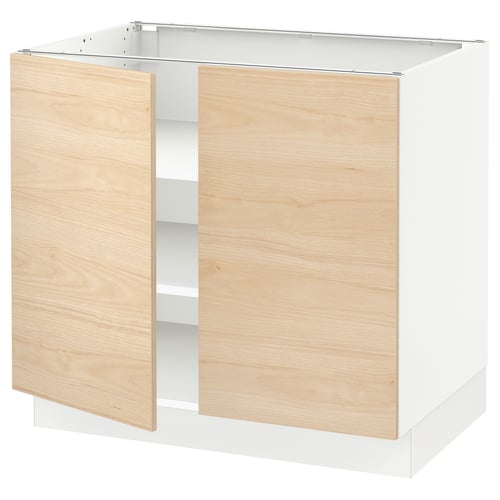 A modern kitchen cabinet named SEKTION with light ash-colored doors and a white frame. It adjustable shelves and snap-on hinges.