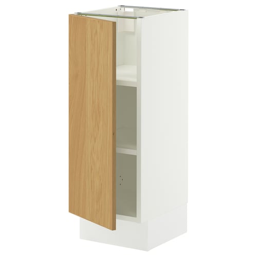 A white SEKTION bathroom cabinet with a light wooden door. It has an adjustable shelf inside and a sleek, modern design.