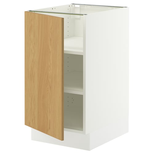 A white SEKTION cabinet with an oak veneer door, left-open. Its rectangular and modern, featuring multiple adjustable shelves.
