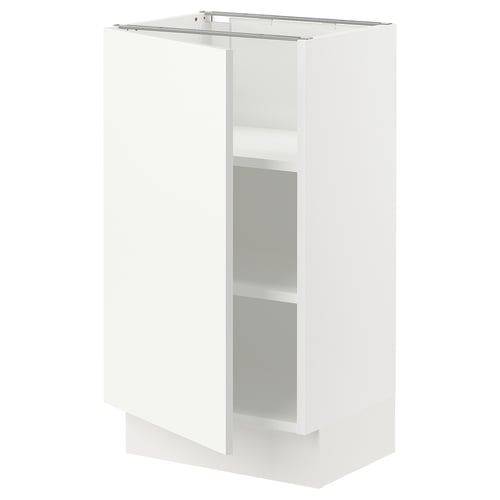 A white SEKTION base cabinet. It a single door and an adjustable shelf inside. The cabinet looks sleek and modern, ideal for kitchen storage.