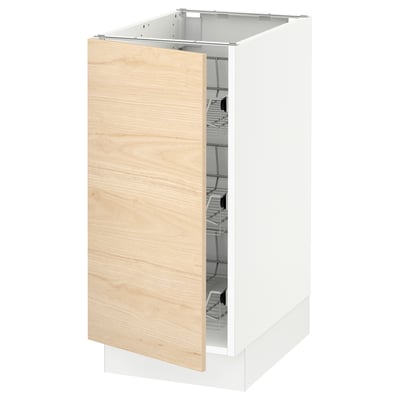 Wooden cabinet door opened, white frame handles visible.