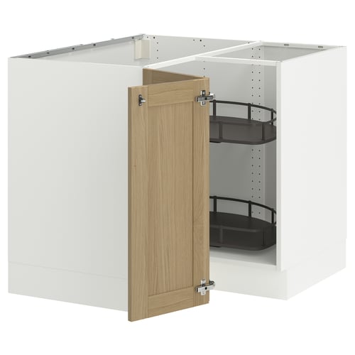 A modern kitchen cabinet setup. It an open white cabinet with a light oak door, holding black shelves.