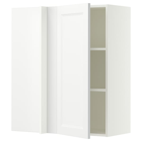 A white SEKTION kitchen cabinet with one door open, revealing shelves inside. The cabinet is rectangular with clean, modern lines.
