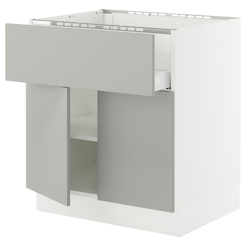 A light grey SEKTION kitchen cabinet with a modern design. It has a drawer with a built-in damper and an adjustable shelf.