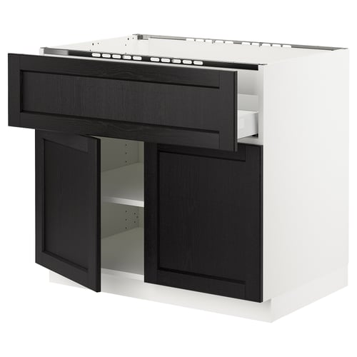 A black and white modern kitchen cabinet with a dark stained wooden door and drawer. It has a sleek design and a metal handle.