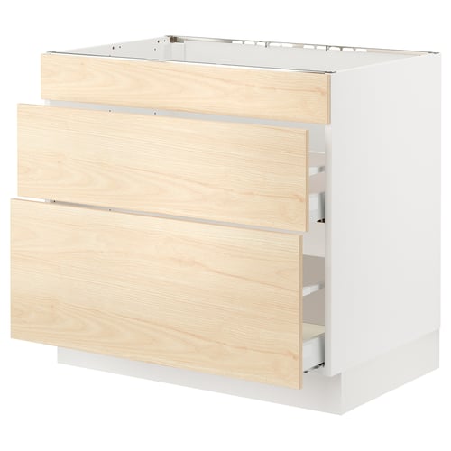 Light wood-toned kitchen cabinet with two visible drawers, featuring a white frame and sleek, modern design.
