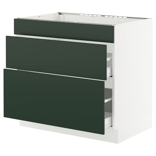 Modern kitchen unit, white with green drawers, rectangular shape, three drawers.