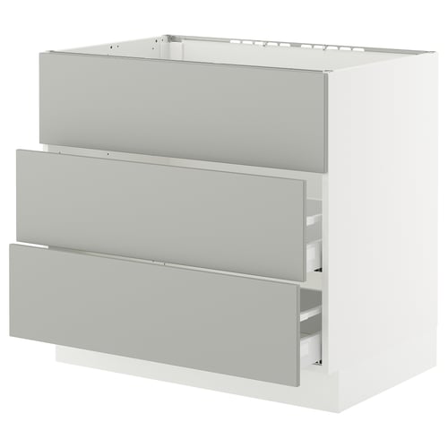 A white SEKTION kitchen cabinet with three light grey drawers. It has a modern, clean design with a smooth finish.
