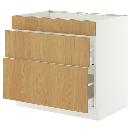 A white and oak-colored SEKTION cabinet with three drawers. The top has a metal grid.