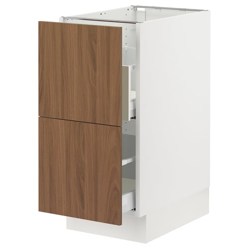 A white ikea SEKTION kitchen cabinet with wooden drawers. Its rectangular with a modern design.