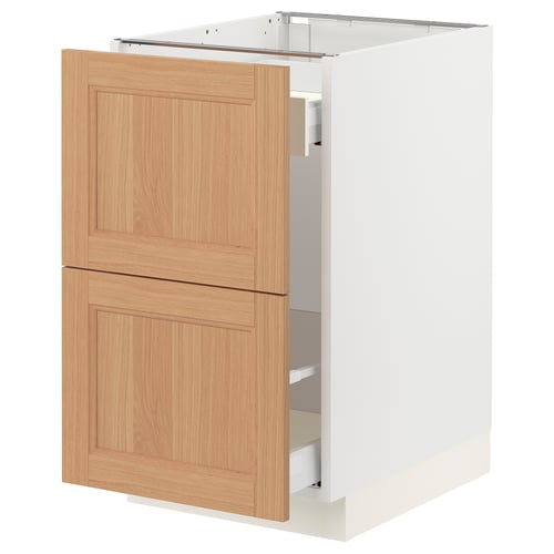 SEKTION kitchen cabinet in light oak wood, featuring two drawers and a single door, with a natural, warm finish.