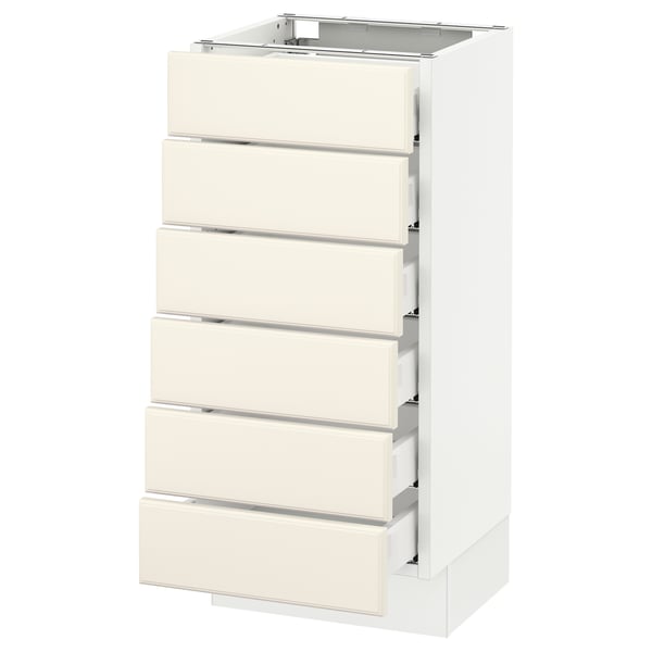 A white SEKTION kitchen cabinet with six off-white drawers and a square top, featuring bevelled edges and smooth-running drawers.