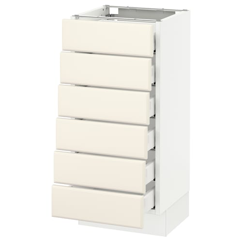 A white SEKTION kitchen cabinet with six off-white drawers and a square top, featuring bevelled edges and smooth-running drawers.