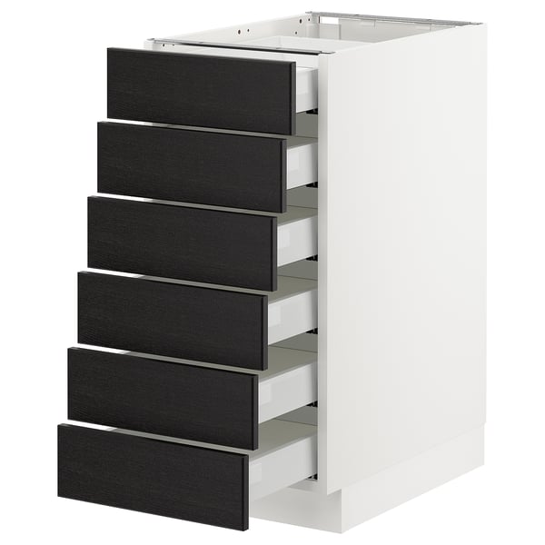 A white SEKTION kitchen cabinet with six black ash drawers.