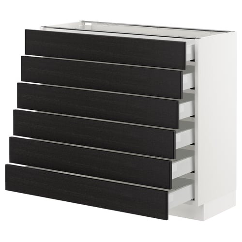 A white cabinet with black stained wooden drawers. It has six drawers with bevelled edges.