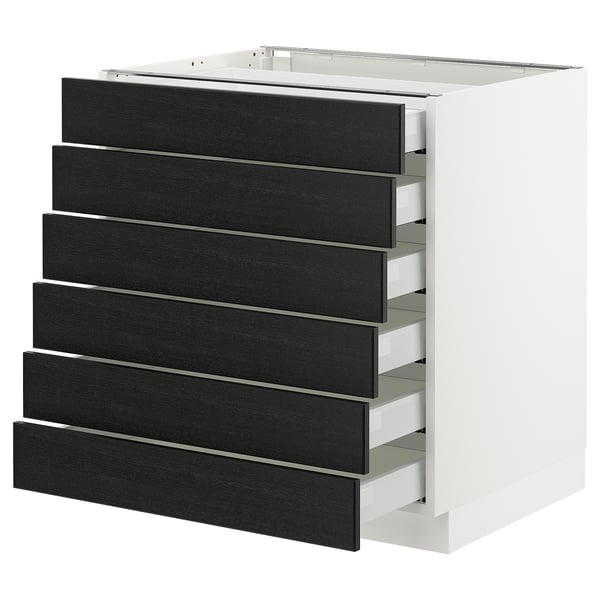 A white SEKTION kitchen unit with six black stained wood drawers.
