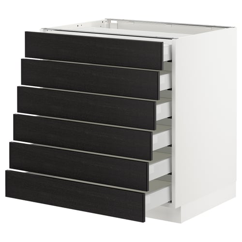 A white SEKTION kitchen unit with six black stained wood drawers.