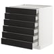 A white SEKTION kitchen unit with six black stained wood drawers.