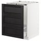 Modern kitchen cabinet: black drawers, white frame, traditional design.