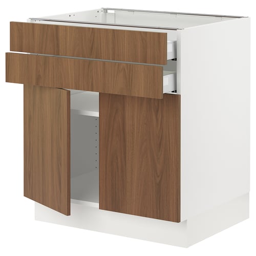 Modern white and walnut kitchen cabinet with open door and drawer. Smooth, minimalist design.