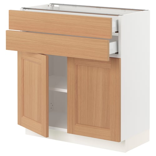 SEKTION kitchen cabinet in oak with natural wood doors and a white base, featuring an open drawer and adjustable shelves.