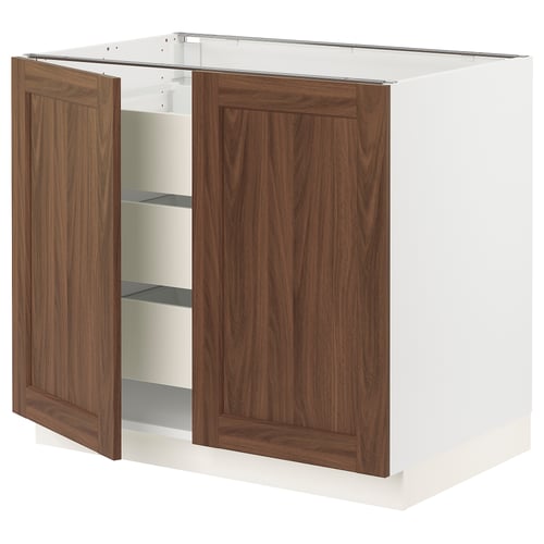 SEKTION kitchen cabinet in white & walnut, featuring open doors with soft-close hinges.