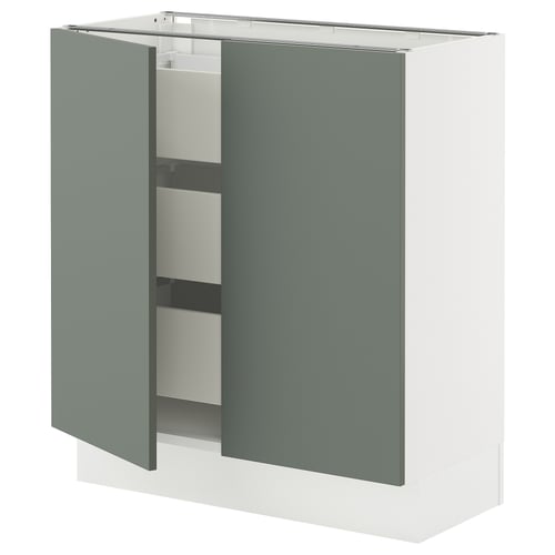 A greenish-grey ikea SEKTION wall cabinet with one open door, revealing white drawers and a wooden base.