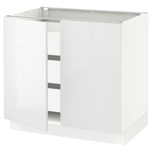 White kitchen cabinet, modern design, glossy finish, rectangular shape, with open compartments and metal support.