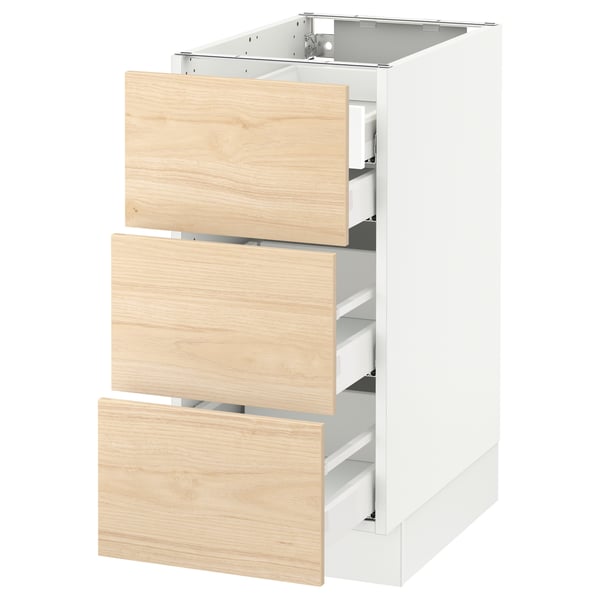 White SEKTION kitchen cabinet with light ash wood drawers.