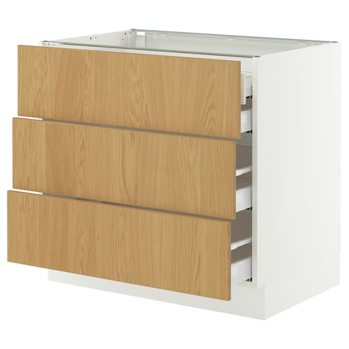 An IKEA SEKTION kitchen unit with three oak drawers, each featuring a smooth, light wood finish and solid oak edges, housed in a white frame.