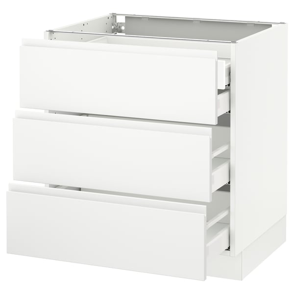 A white SEKTION kitchen cabinet with three drawers, featuring a modern, minimalist design with integrated handles.