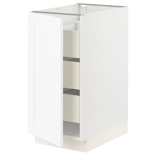 White kitchen cabinet with shelves and closed door.