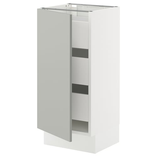 An open light grey SEKTION kitchen cabinet from IKEA, revealing adjustable shelves.