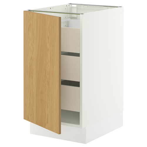 The SEKTION kitchen cabinet in white with a light oak door, featuring three shelves inside.