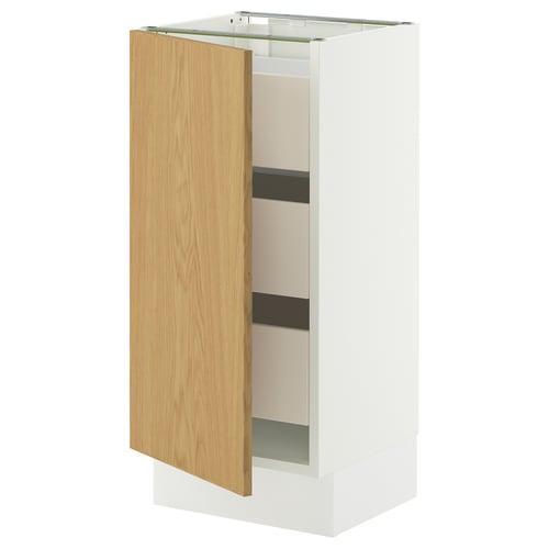 A white and light wood cabinet with a single door slightly ajar, revealing shelves inside. The cabinet has a modern design with a smooth finish.