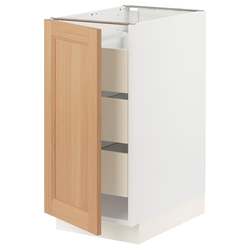 SEKTION white kitchen cabinet with oak door, open showing shelves.