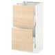 White kitchen base unit with light wooden drawers.