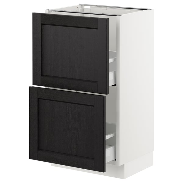 A modern kitchen cabinet, the SEKTION, with black-stained wooden doors, a white frame, and practical drawers.