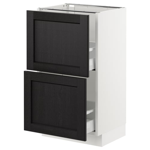 A modern kitchen cabinet, the SEKTION, with black-stained wooden doors, a white frame, and practical drawers.