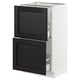 A modern kitchen cabinet, the SEKTION, with black-stained wooden doors, a white frame, and practical drawers.