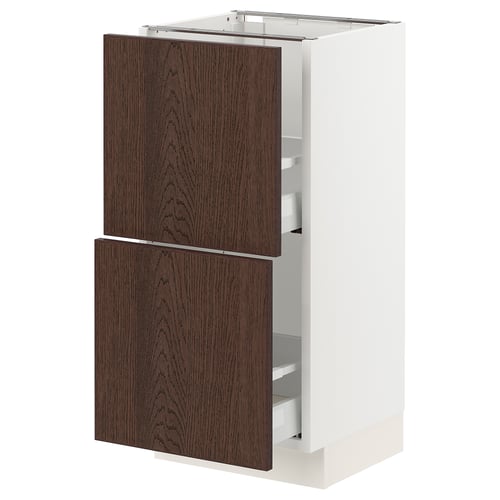 Modern oak-colored kitchen cabinet with white frame and pull-out shelves.