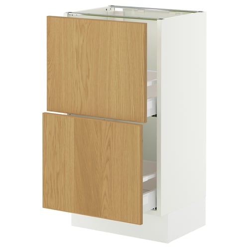 White SEKTION kitchen cabinet with oak doors, featuring two open drawers. Modern and minimalist design.