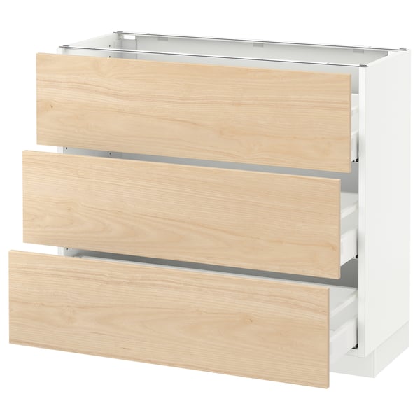 A SEKTION kitchen cabinet with three light ashwood drawers and a white frame.