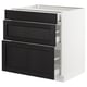 Modern kitchen cabinet with three black drawers, white frame.