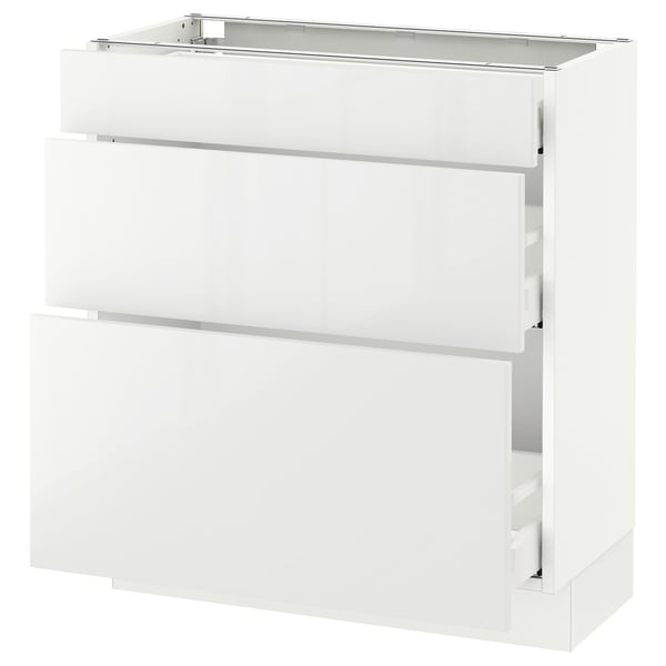 A white SEKTION kitchen cabinet with modern design. It has multiple drawers with high-gloss fronts.