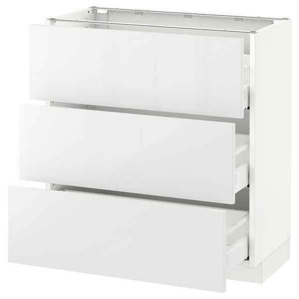 White SEKTION kitchen cabinet with glossy finish and multiple drawers.