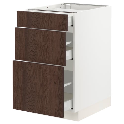 An ikea SEKTION kitchen cabinet with three dark brown wooden drawers and a white base.
